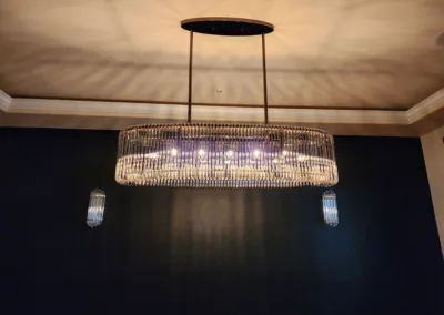 A large chandelier hanging in a dark room.