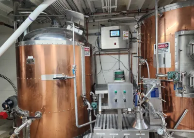 Copper brewing tanks in a brewery.