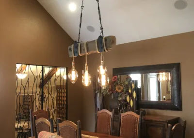 A dining room with a wooden table and chairs.